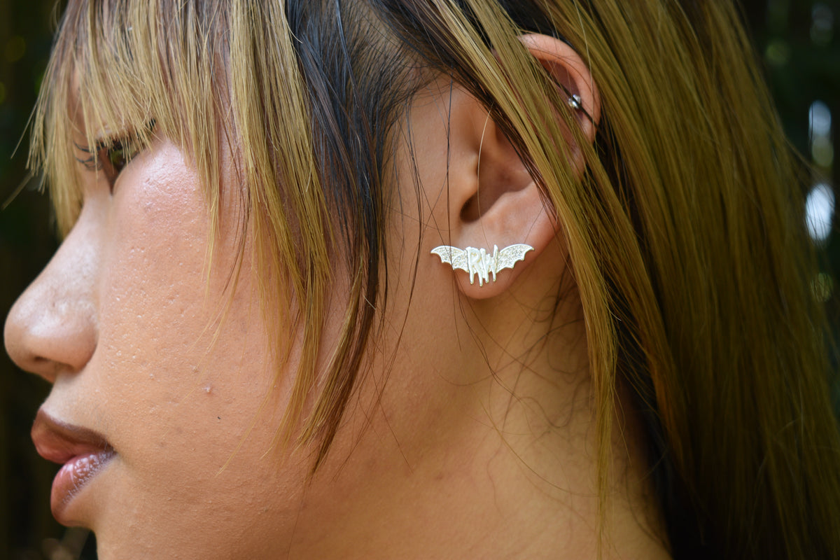 Roxy wrld silver bat wings earring