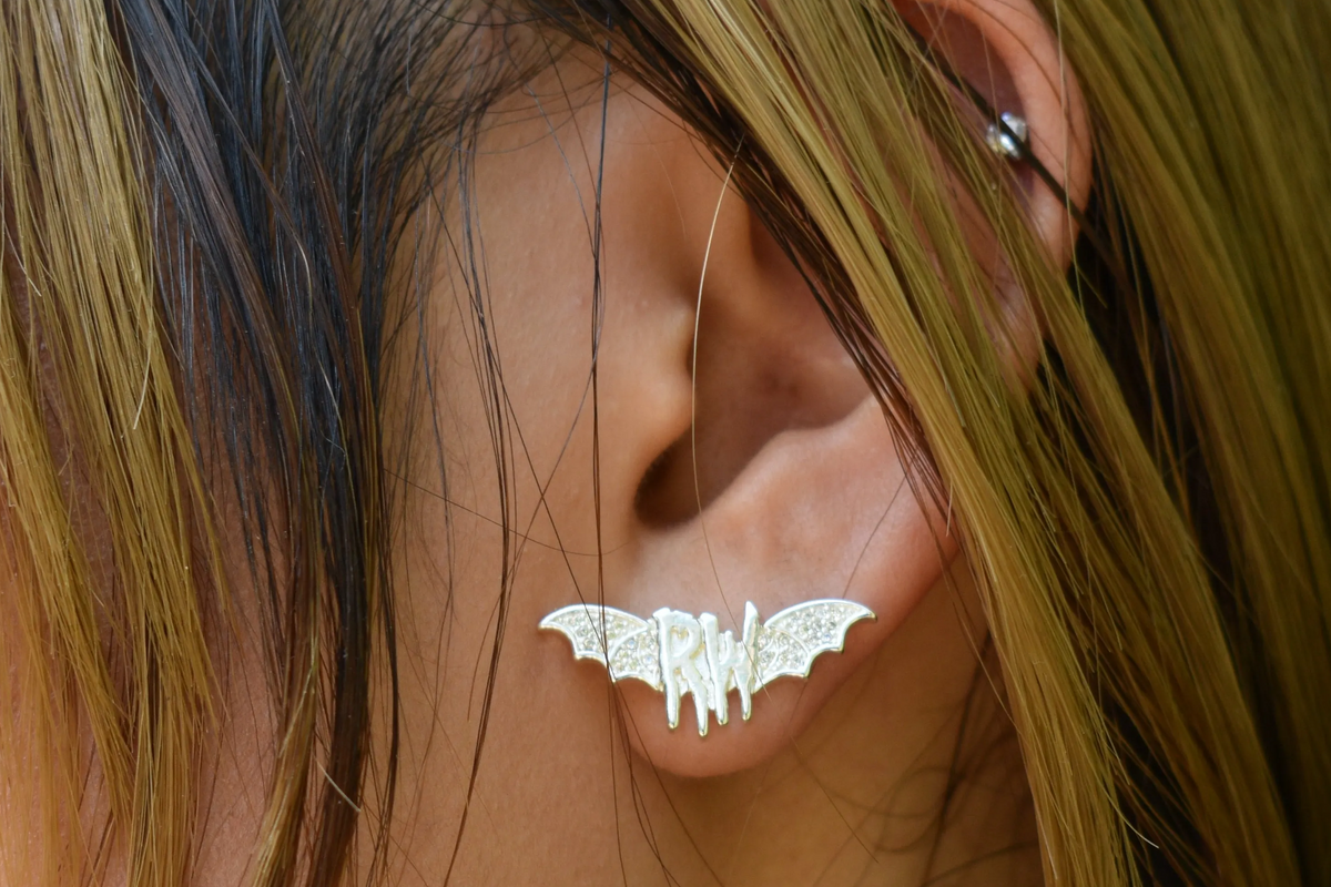 Roxy wrld silver bat wings earring