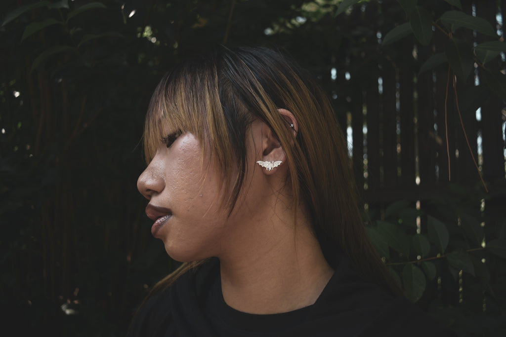 Roxy wrld silver bat wings earring