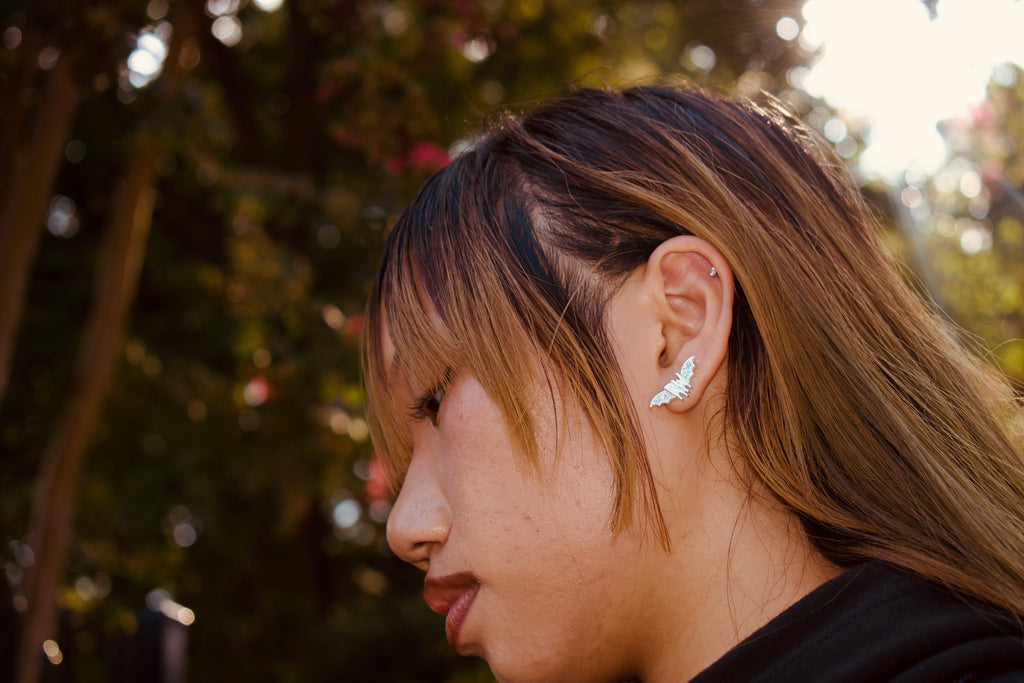 Roxy wrld silver bat wings earring
